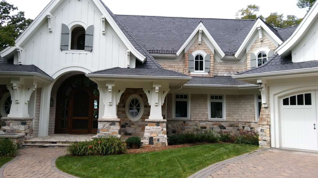Luxury white stone home exterior repaint